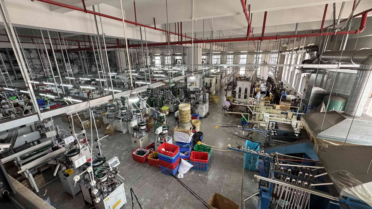 CEO Zipper factory floor with multiple zipper production lines in operation
