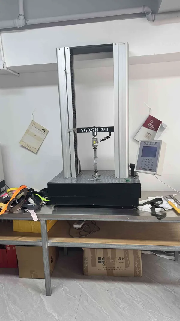 Tensile strength testing equipment measuring zipper pull force at CEO Zipper QC lab